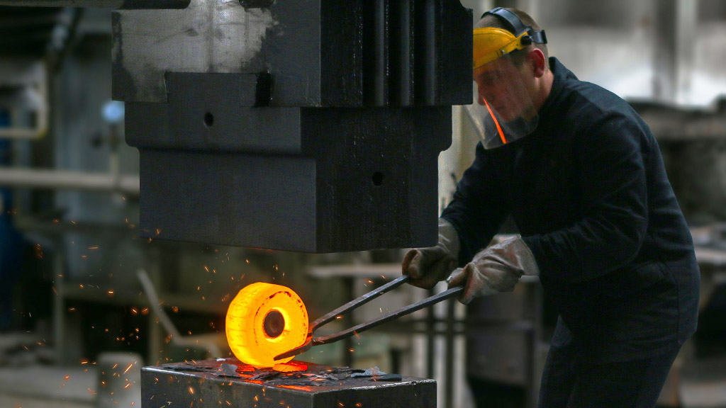 A man working with molten metal - photo by Kateryna Babaieva